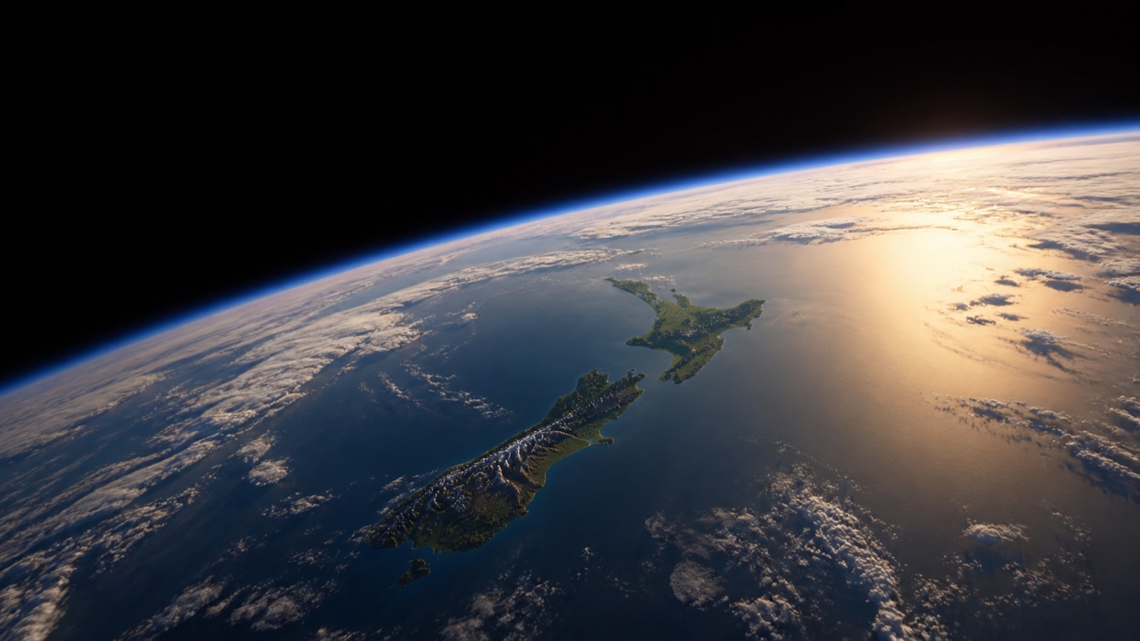New Zealand seen from space, sunlight breaking across the Pacific