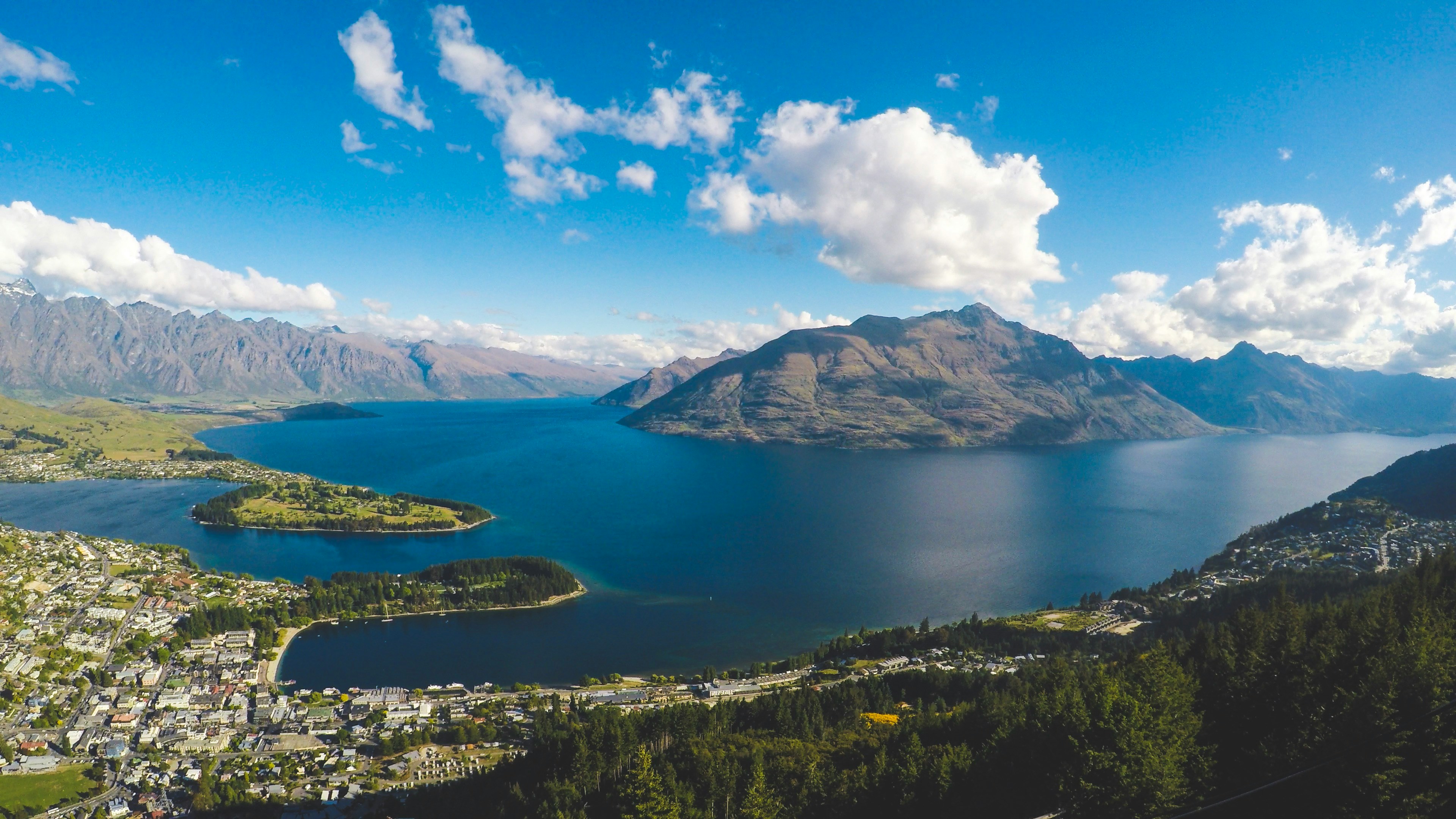 Aerial view of Lake Wakatipu and Queenstown ringed by mountains, New Zealand
